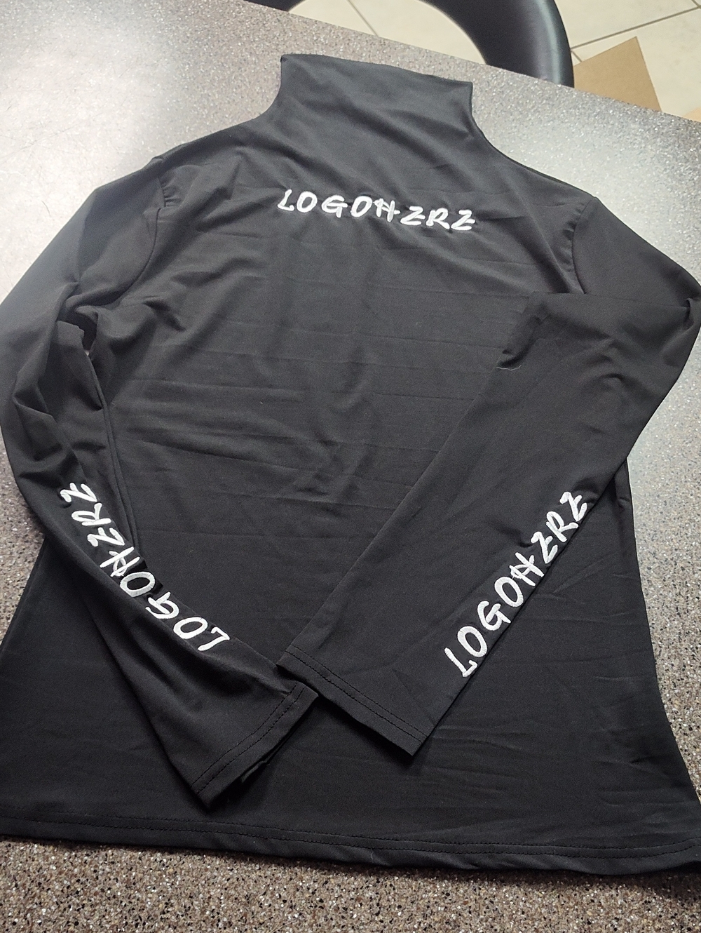 Black Long-Sleeve Women's Tee with Sleeve Script